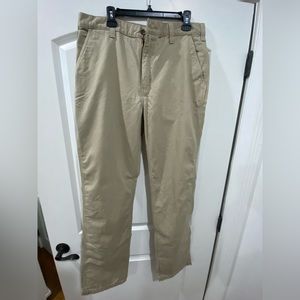 Carhartt men’s 36 x 36 khaki work pants with side pocket.
